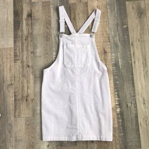 Overall dress in purple.